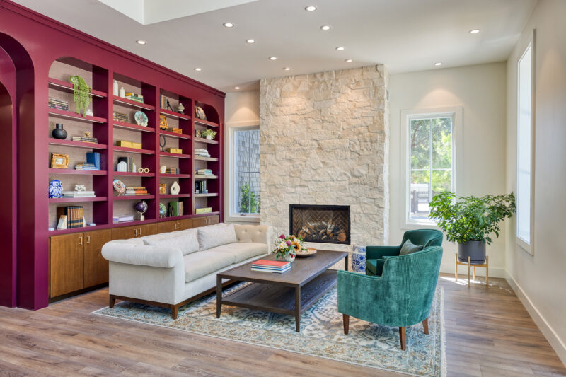 a living room filled with furniture and a fire place