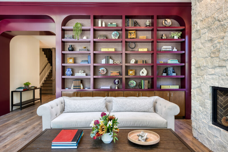 a living room filled with furniture and a fire place