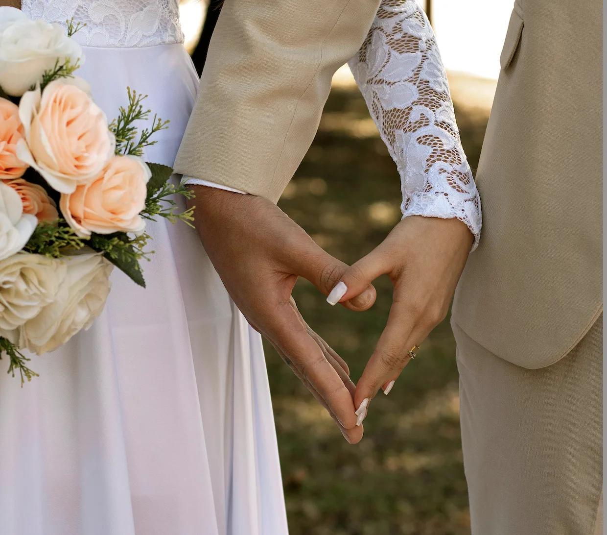 a close up of a person holding the hand of another person