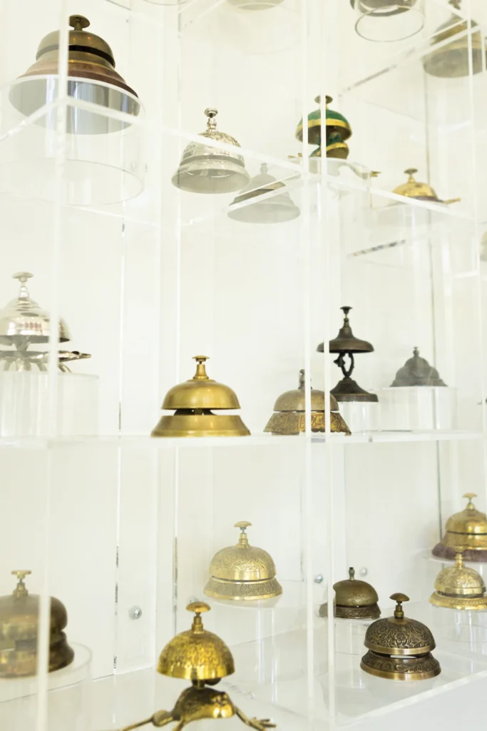 a display case filled with lots of different types of bells