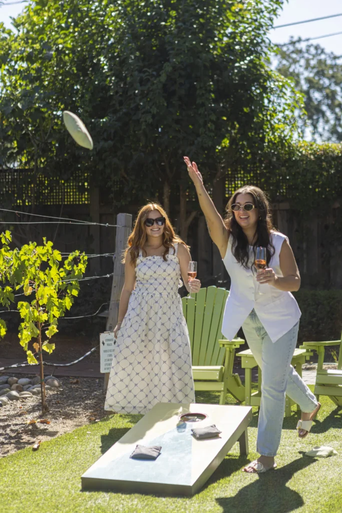 a couple of women playing a game of frisbee