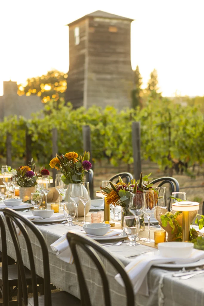 a table with a bunch of plates and glasses on it