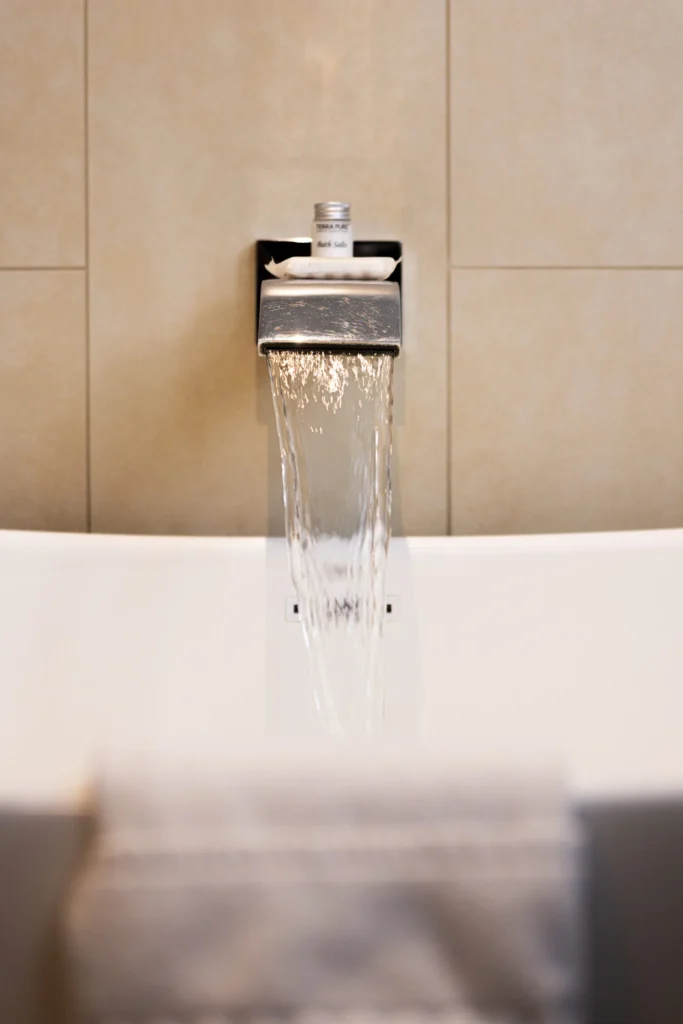a close up of a faucet in a bathtub