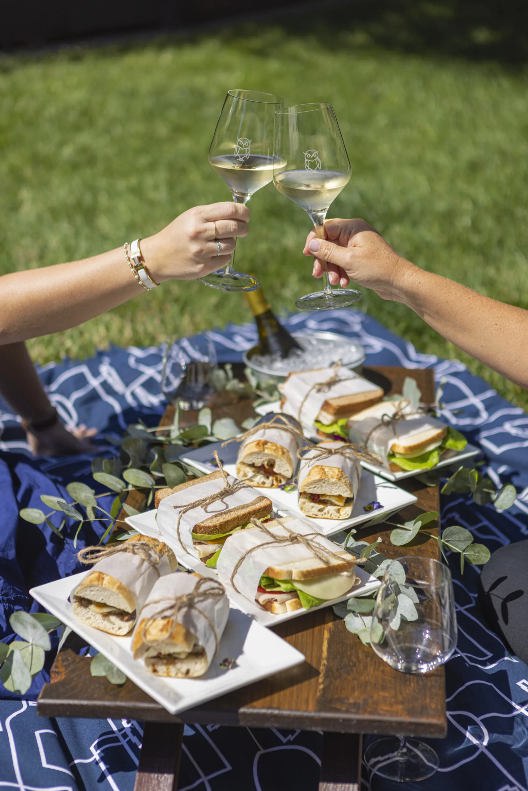 a couple of people that are holding wine glasses