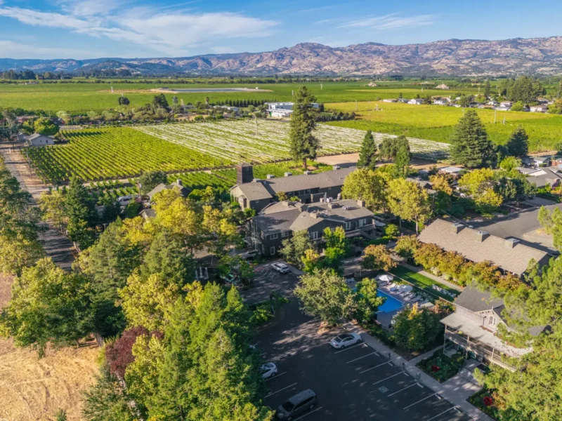 an aerial view of a home surrounded by trees