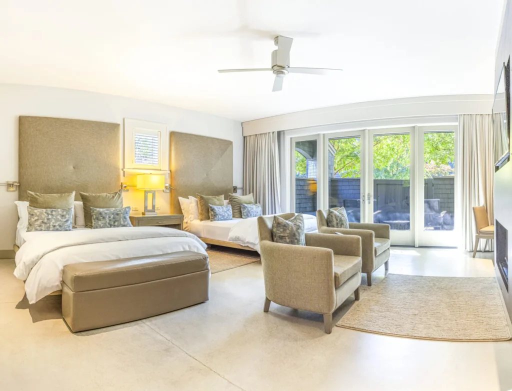 a bedroom with a large bed and a sitting area