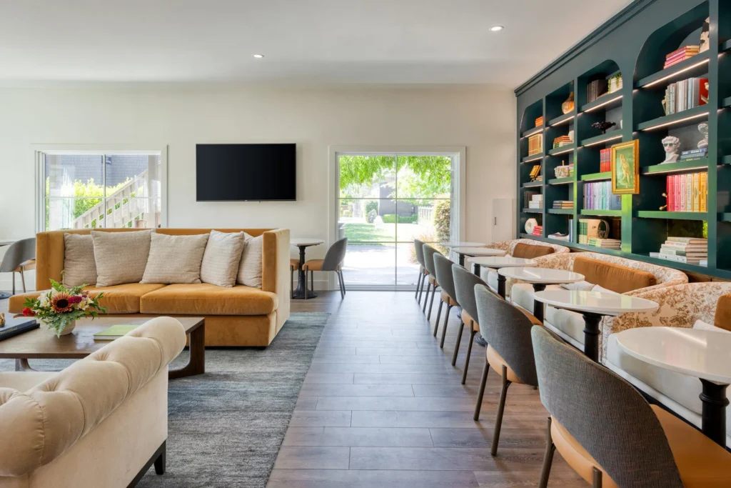 a living room filled with furniture and a flat screen tv