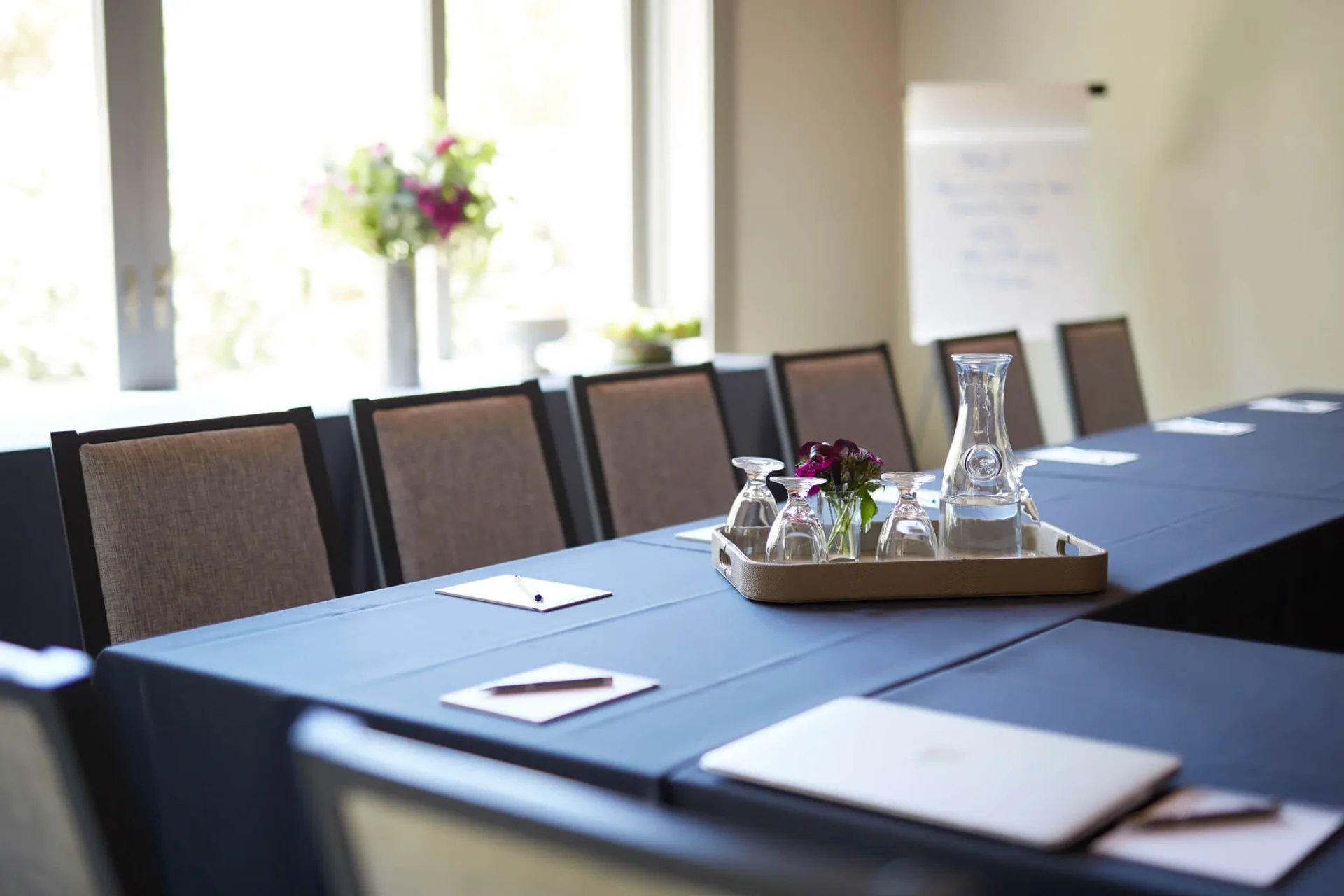 a long table with a tray of flasks on it