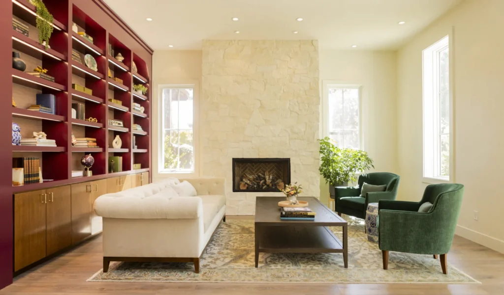 a living room filled with furniture and a fire place