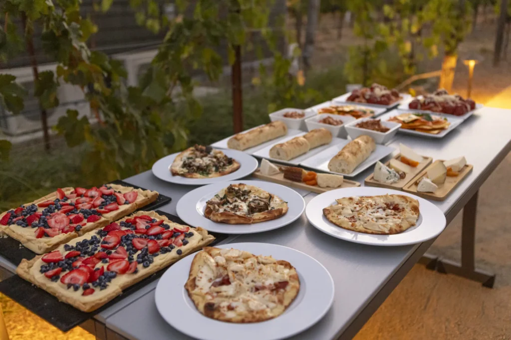 a table topped with lots of plates of food
