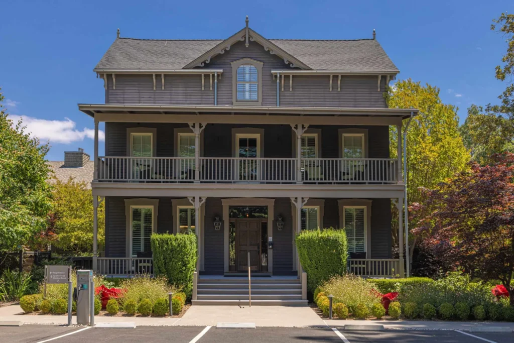 a two story house with a large front porch