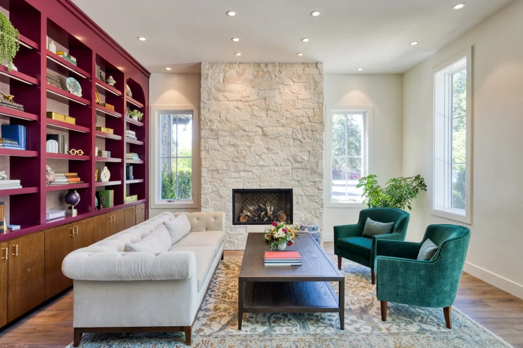 a living room filled with furniture and a fire place