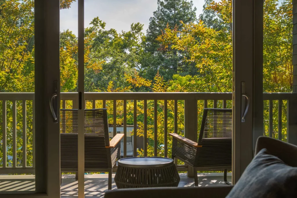 Balcony seating area with forest view