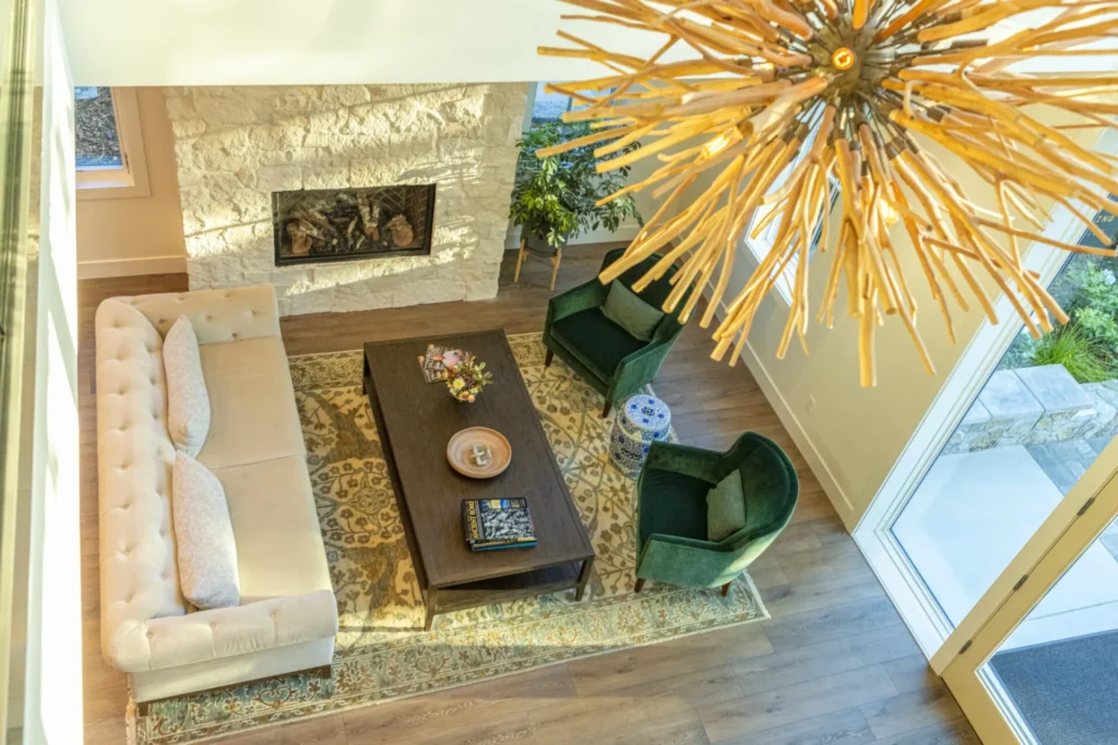 a living room filled with furniture and a fire place